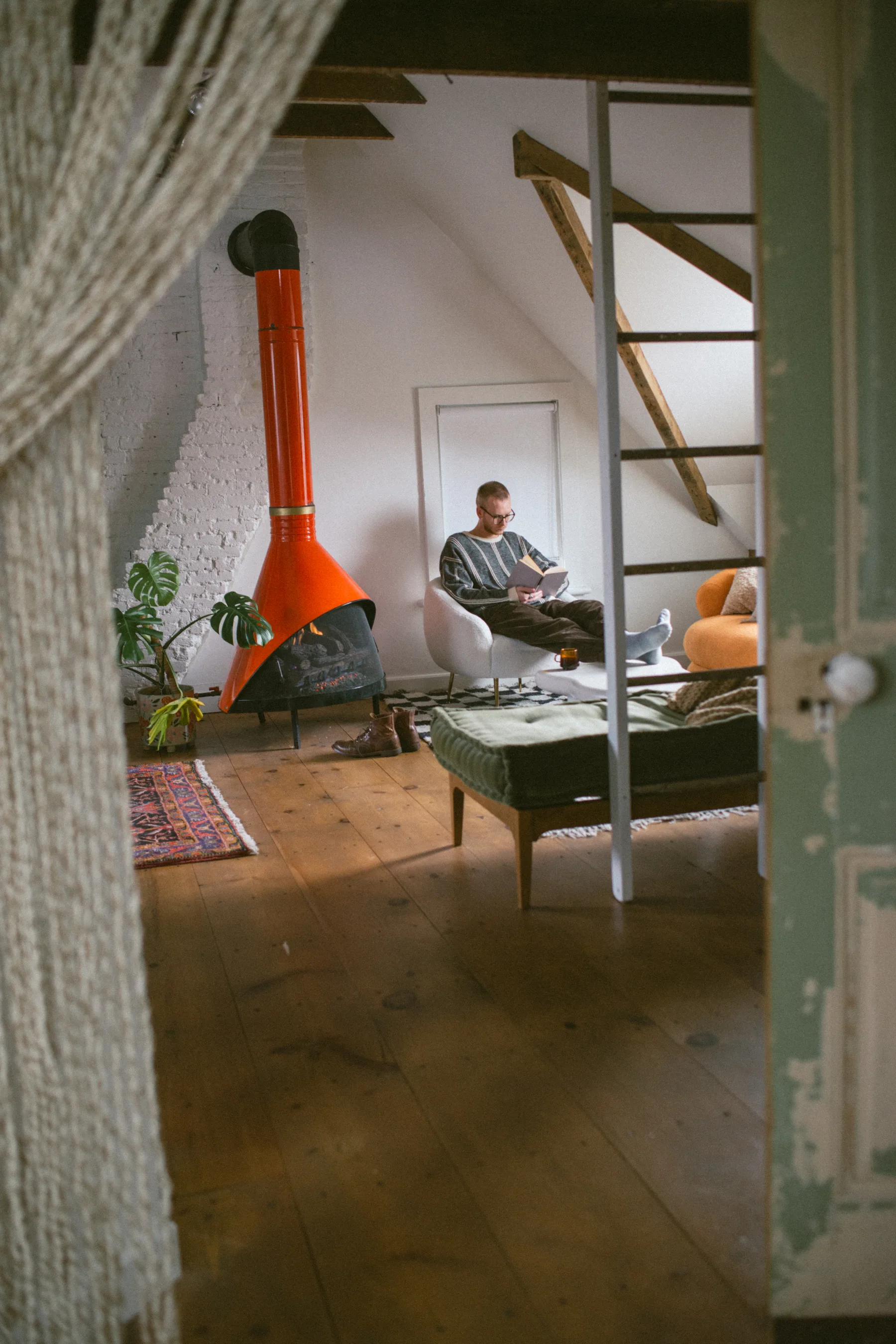 Finished attic conversion with exposed rafters and reading nook
