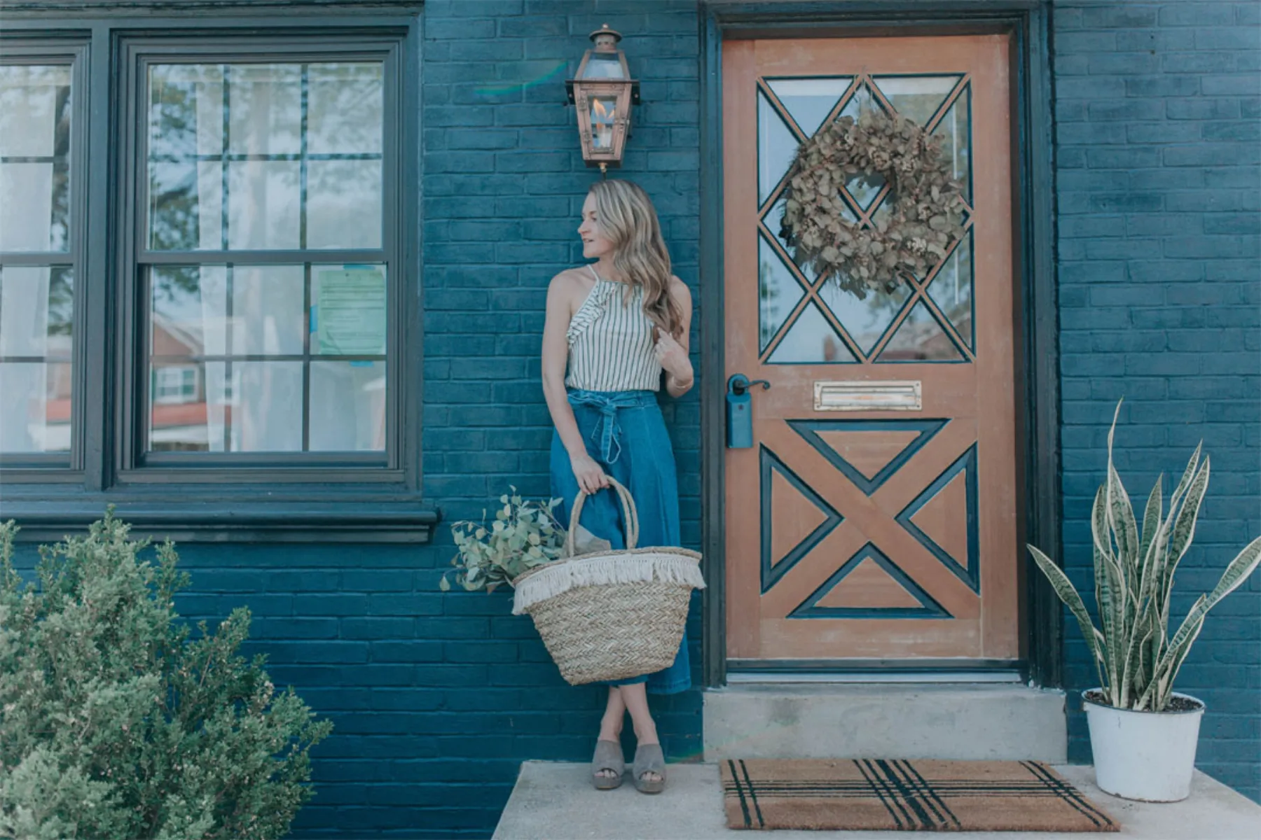 Navy painted brick row house front entry